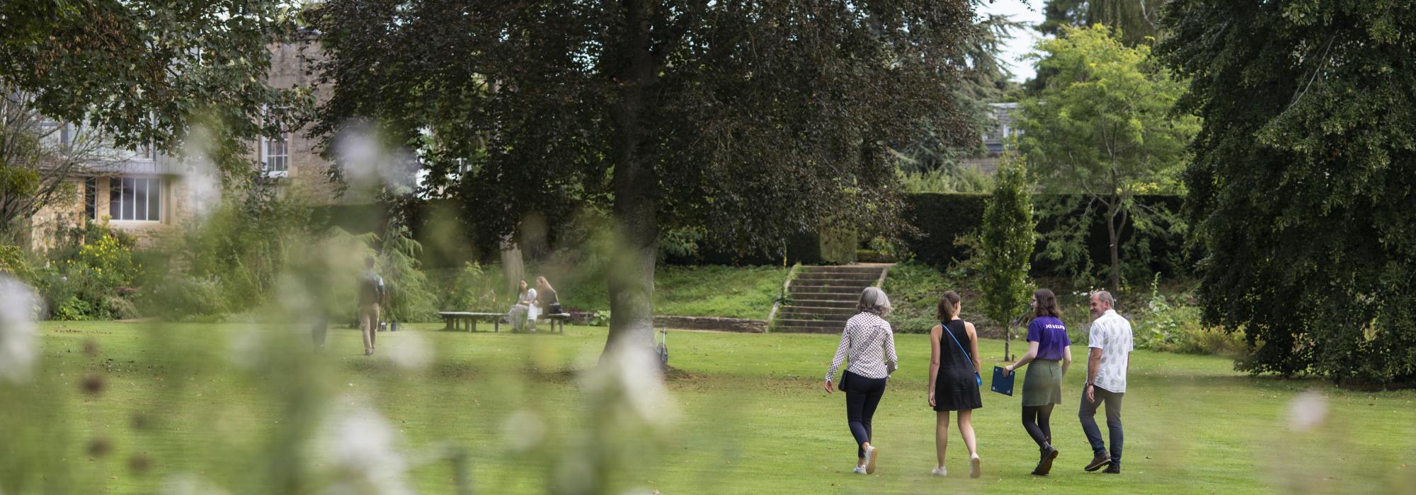 Students walking in Fellows Garden