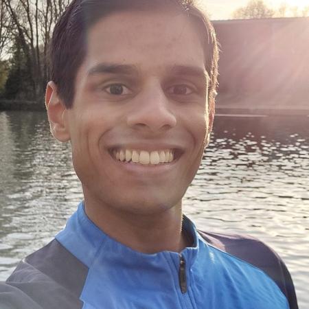 young man by the river in the sun